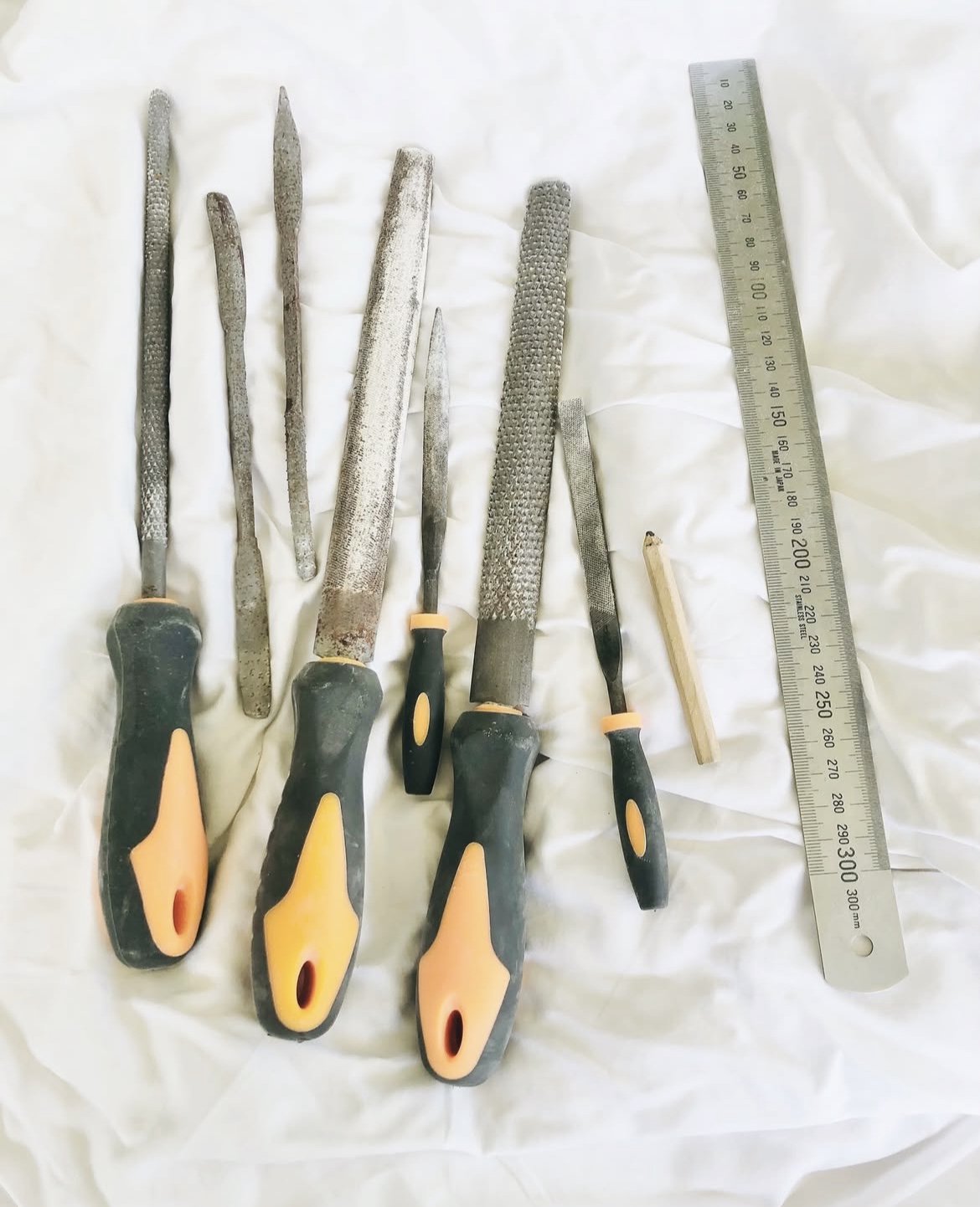 Hand carving tools laid out in the studio